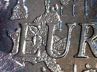 1-Euro 1999 (Spanien) mit normaler Länderstruktur (li.) und mit fehlerhafter Länderstruktur. Schätzung: 30 Euro.